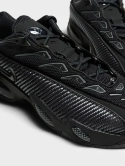 Nocta Glide Sneakers i Black, Black, Iron Grey og University Gold