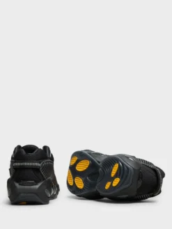 Nocta Glide Sneakers i Black, Black, Iron Grey og University Gold