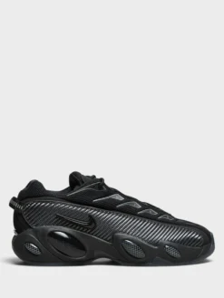 Nocta Glide Sneakers i Black, Black, Iron Grey og University Gold